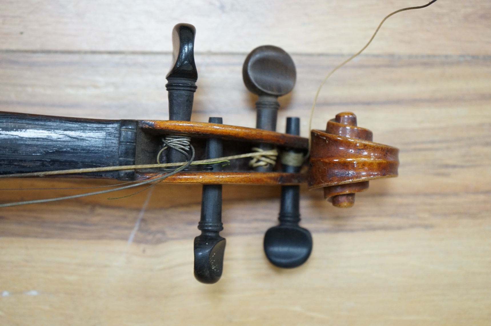 A cased full length violin, circa 1900, with bow, bears Stradivarius label to the interior. CITES Submission reference WVME8714